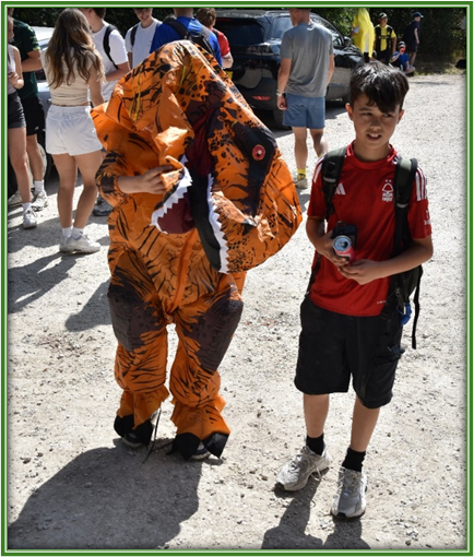 students - sponsored walk - one dressed as a dinosaur