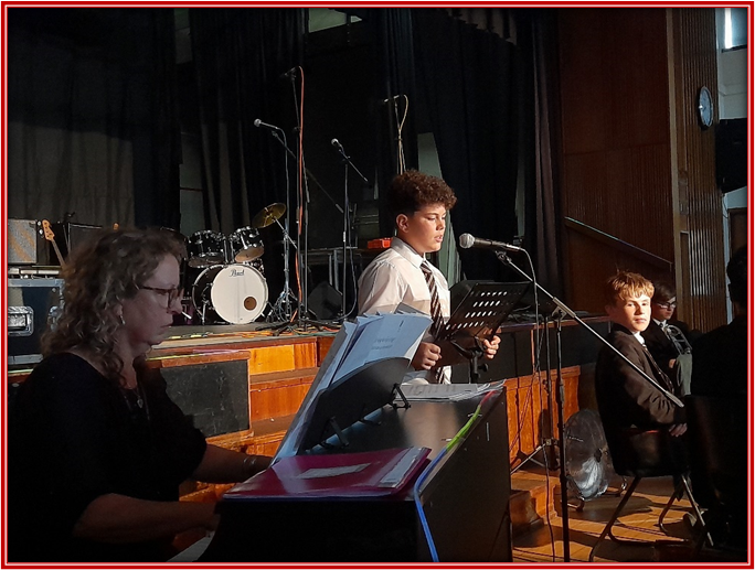 student singing along to the piano