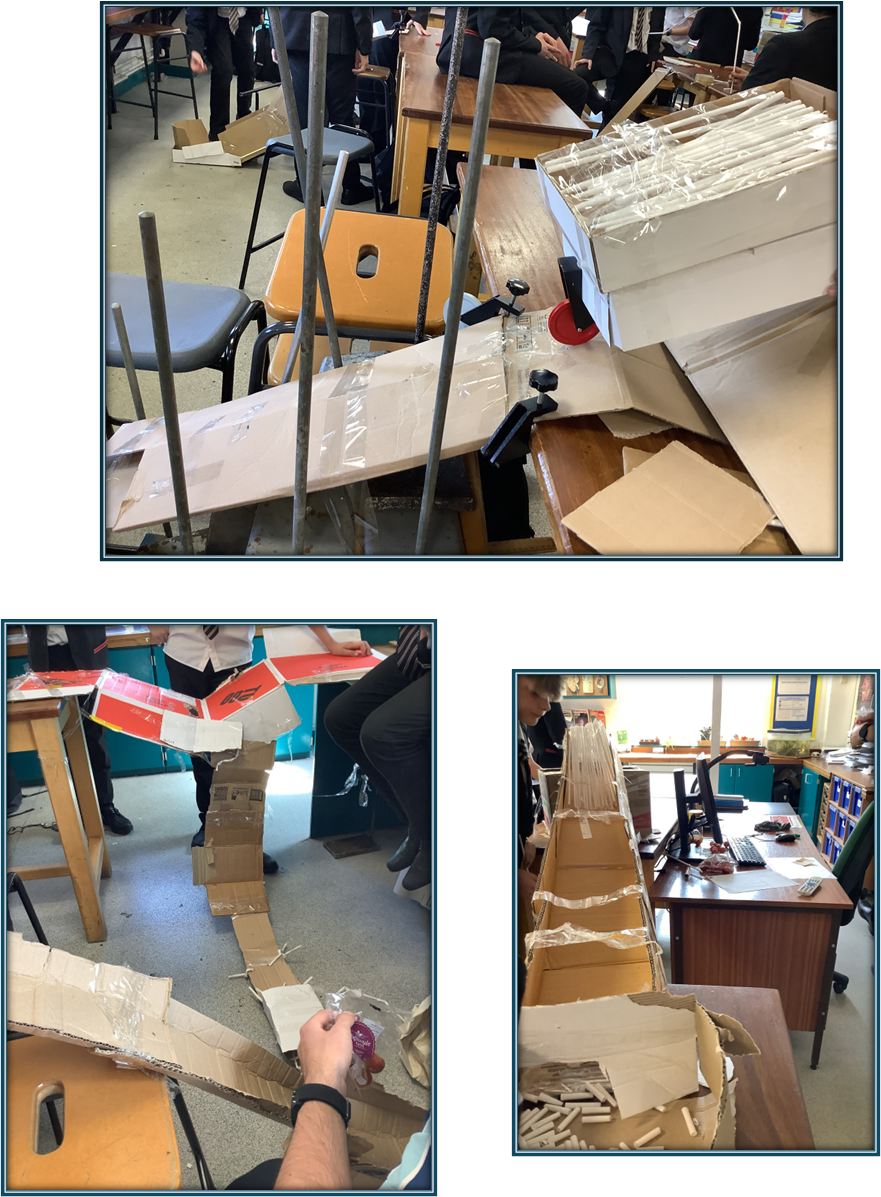 making a slope out of cardboard boxes and chairs