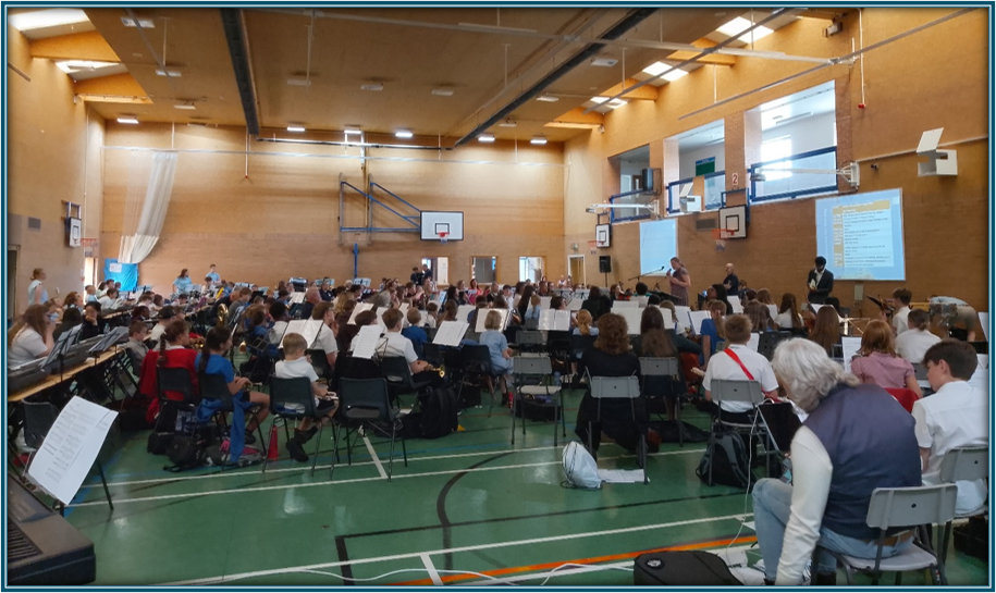 students in the hall playing musical instruments