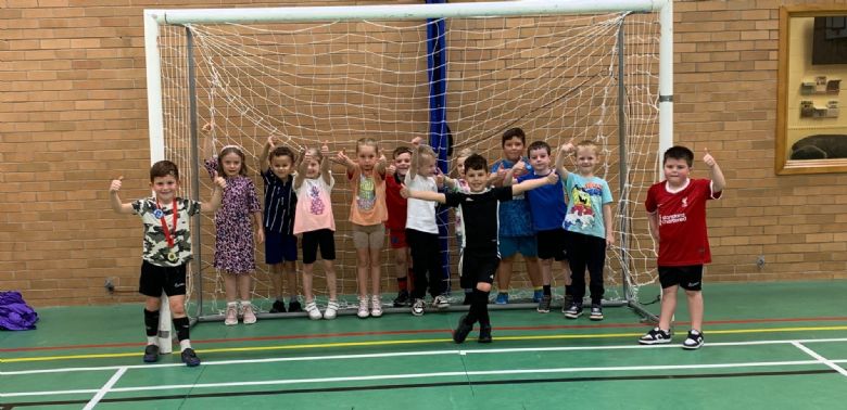 A group of children taking part in an activity in the Sports Hall A group of children taking part in an activity in the Sports Hall